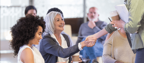 A group of wellness professionals at an industry event
